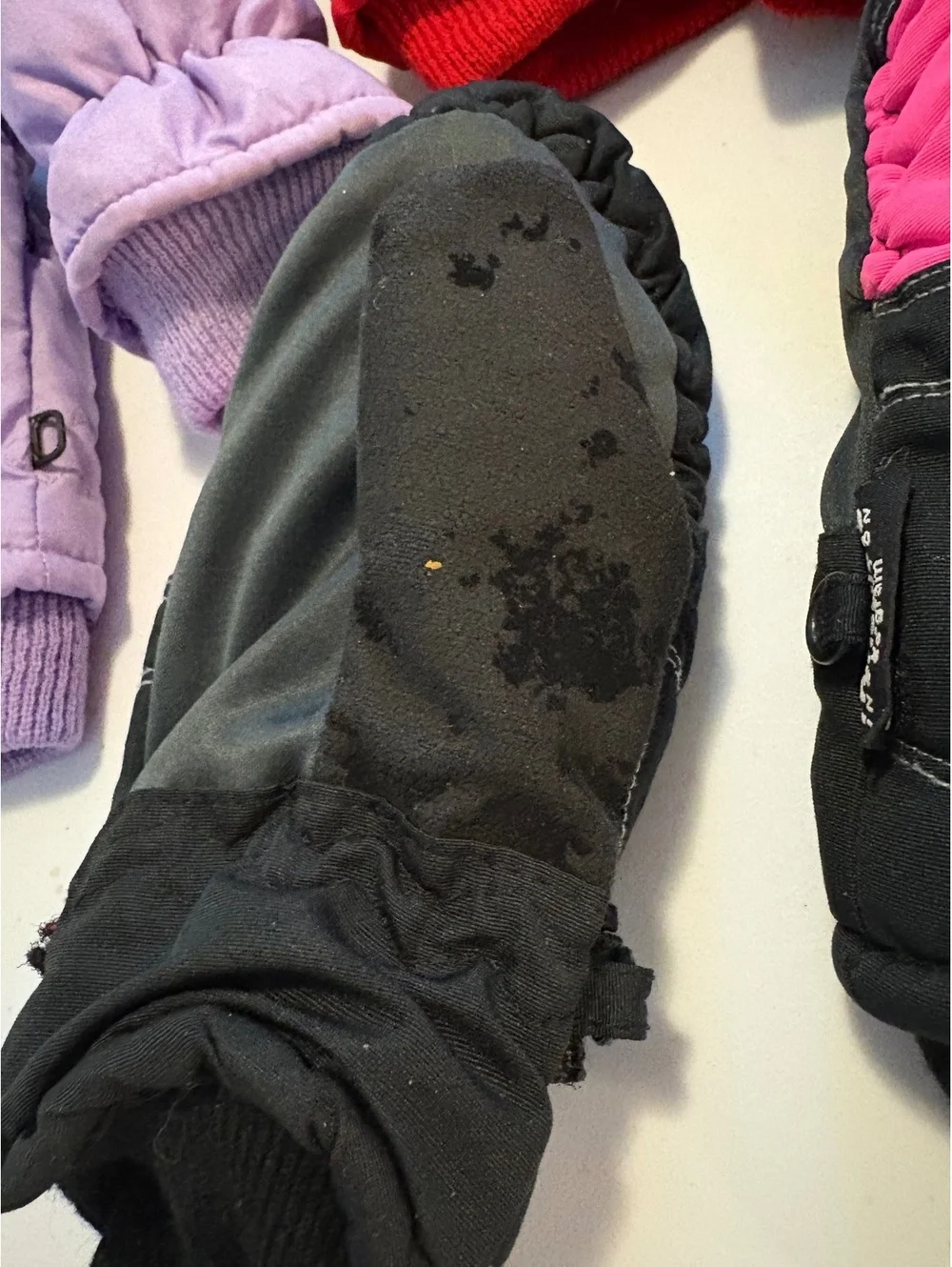 Three pairs of kids mittens